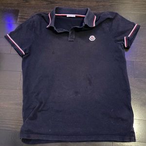 Men’s Moncler Polo size medium but fits like small.